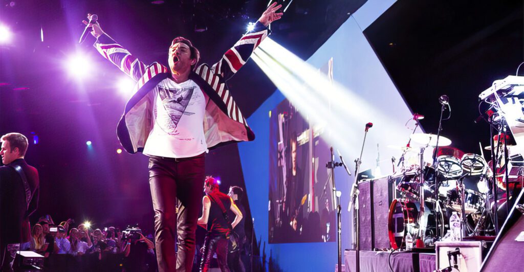 Energetic lead singer performing on stage with vibrant lighting and enthusiastic crowd.